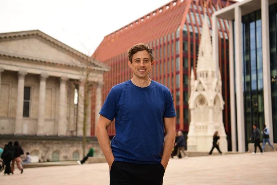 Nick Holzherr headshot, city square